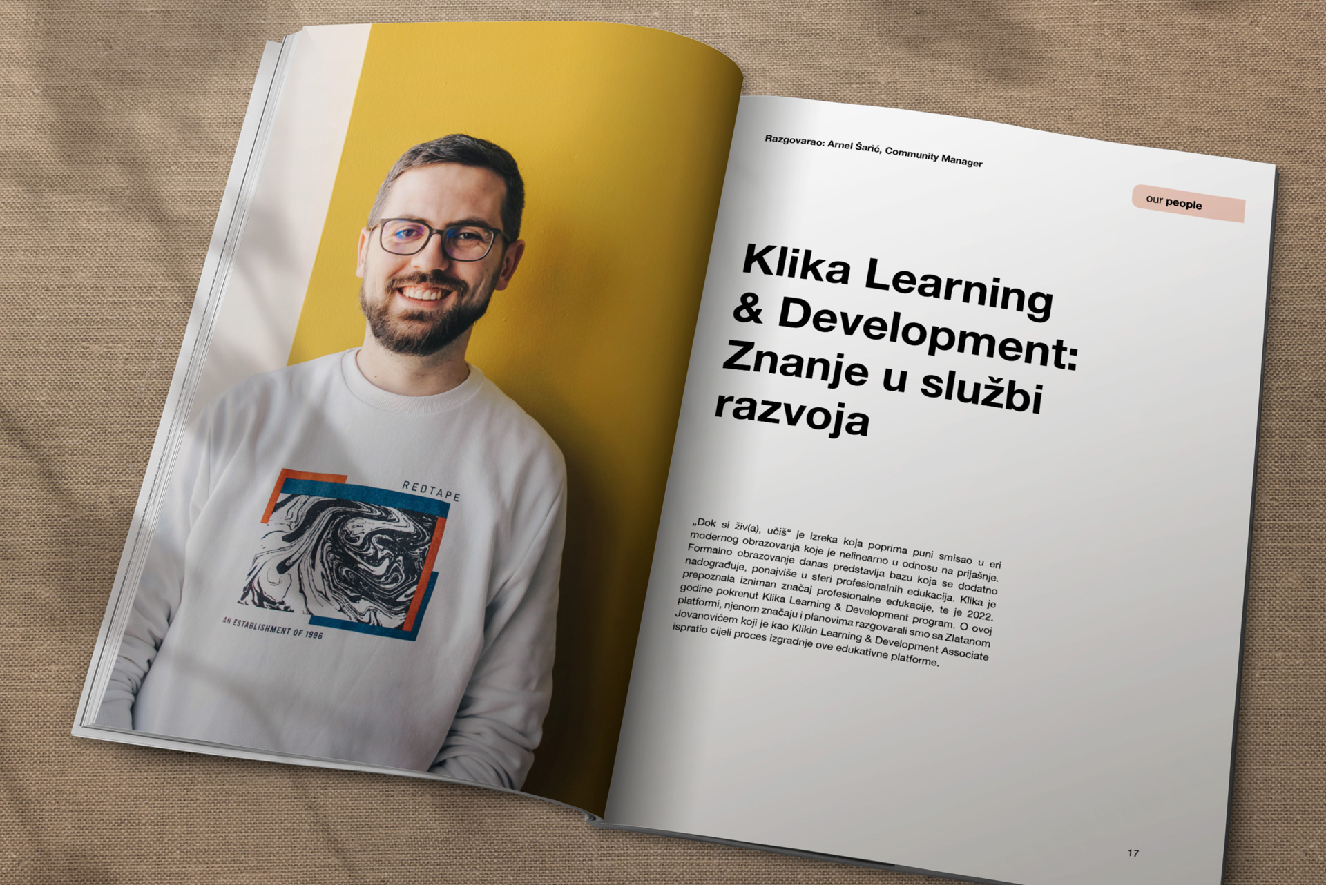 mockup featuring-a-man-holding-an-open-magazine-in-his-living-room-3386-el1